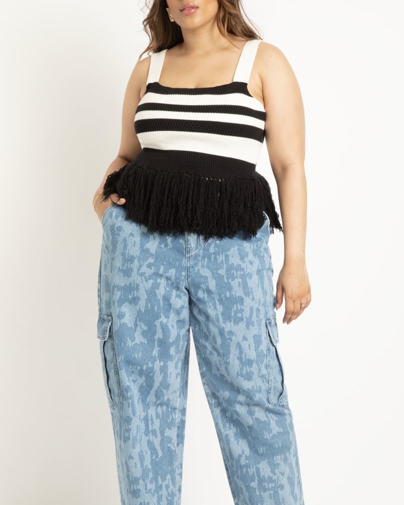 Front of a model wearing a size 26 Printed Cargo Jean in Set Sail by ELOQUII. | dia_product_style_image_id:303845